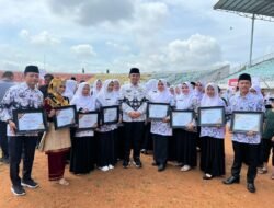 Bupati Sutan Riska Hadiri Puncak Hari Guru Nasional